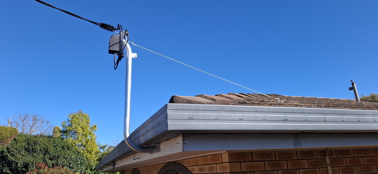 Completed Point of Attachment upgrade with redundant former POA hardware visible on the roof