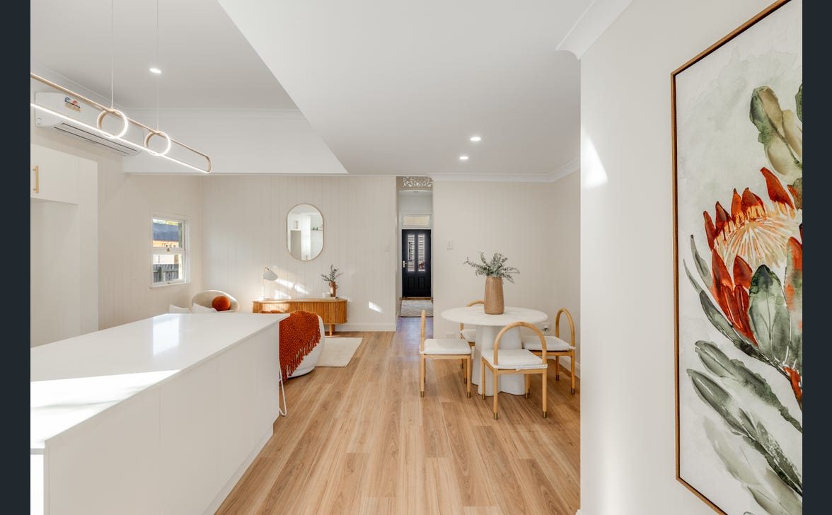 Dining and living area with feature pendant and downlights